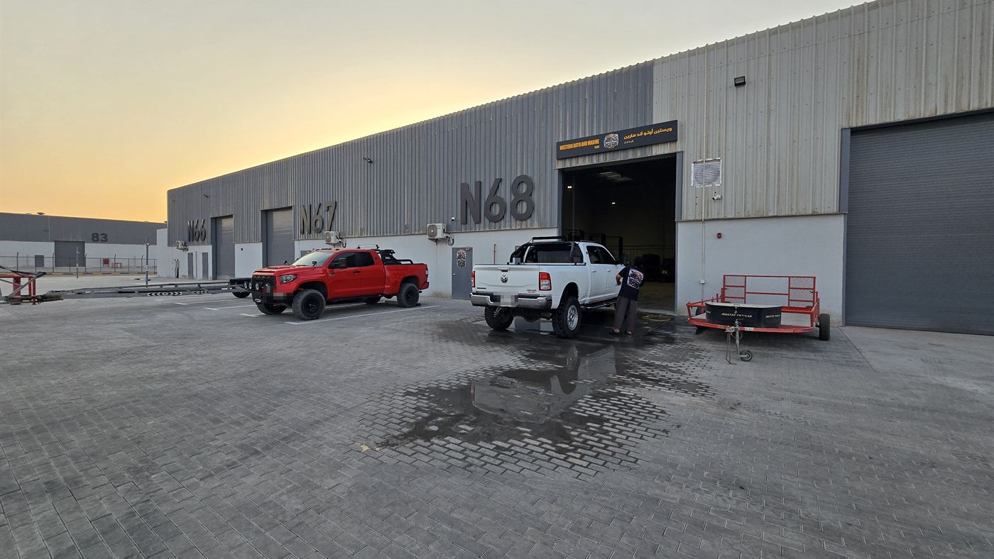 Western Auto and Marine workshop in Al Hamra at dusk