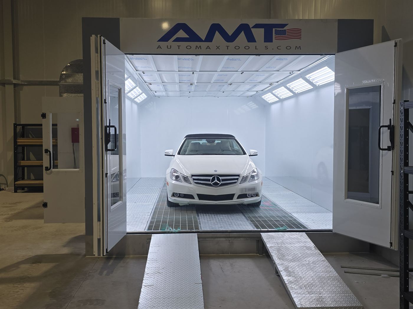 White Mercedes convertible inside the spray paint booth at Western Auto and Marine