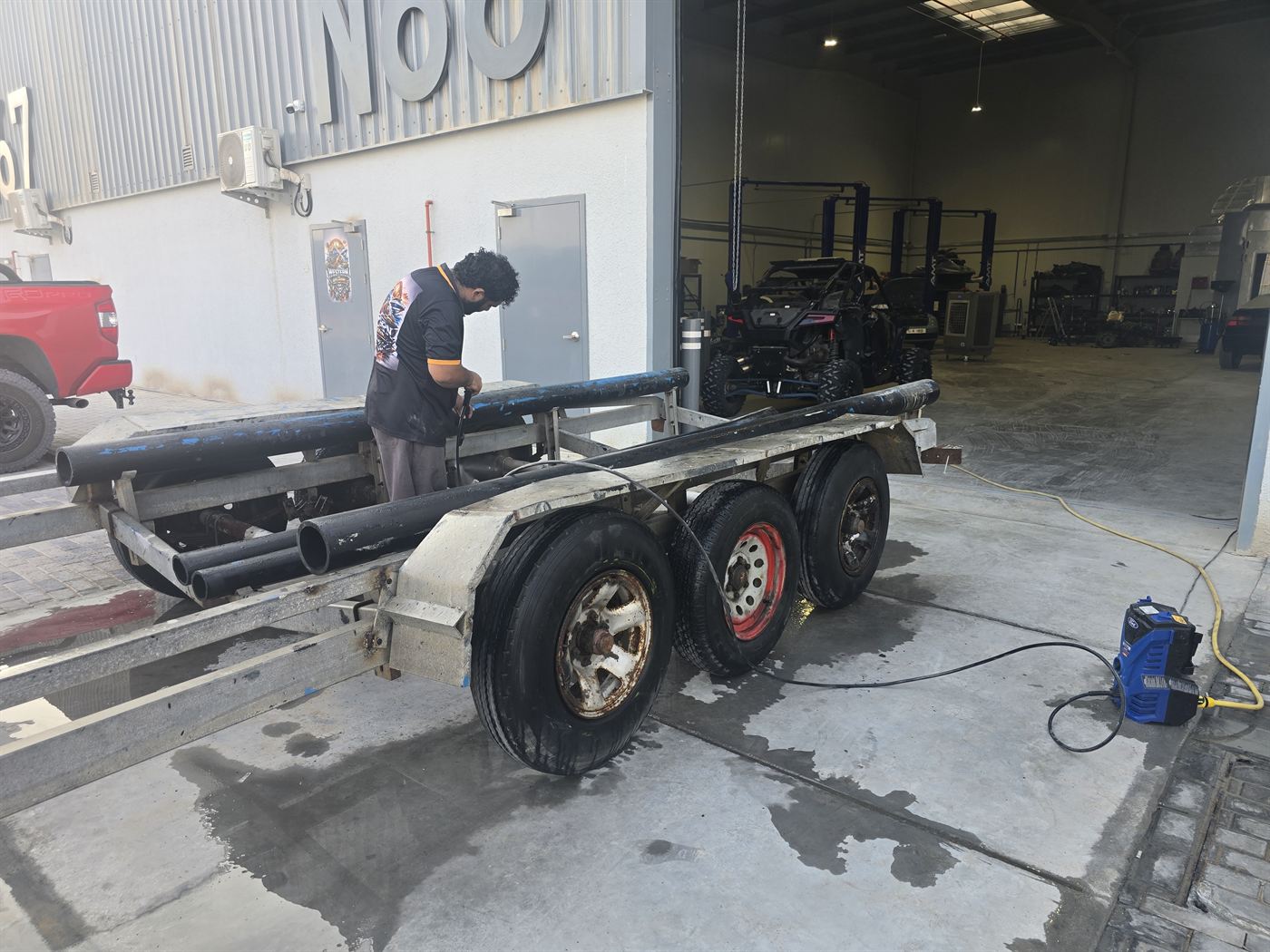 A boat trailer being cleaned and inspected in the Western Auto and Marine yard, Ras Al Khaimah