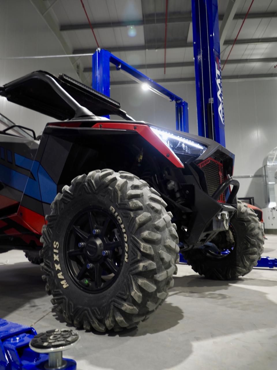 Off-road UTV side-by-side on the lift at Western Auto and Marine, Ras Al Khaimah